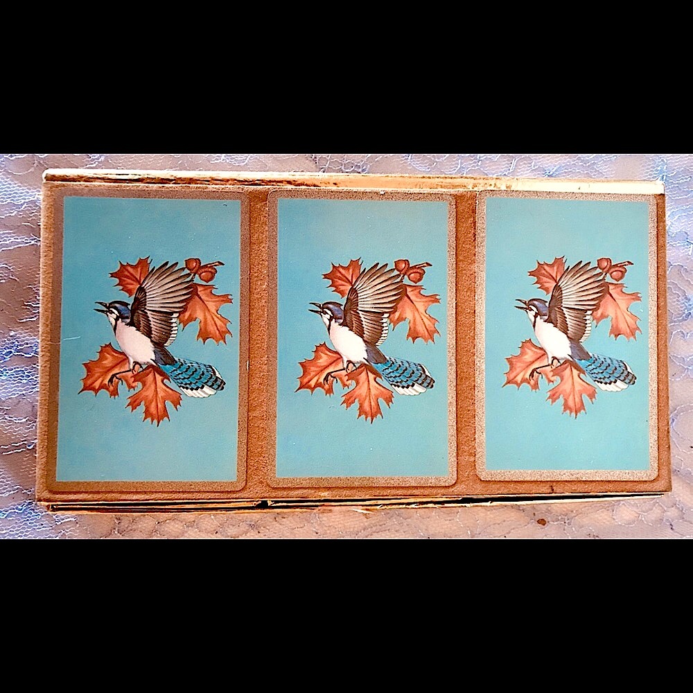 Boxed set of three decks of vintage playing cards